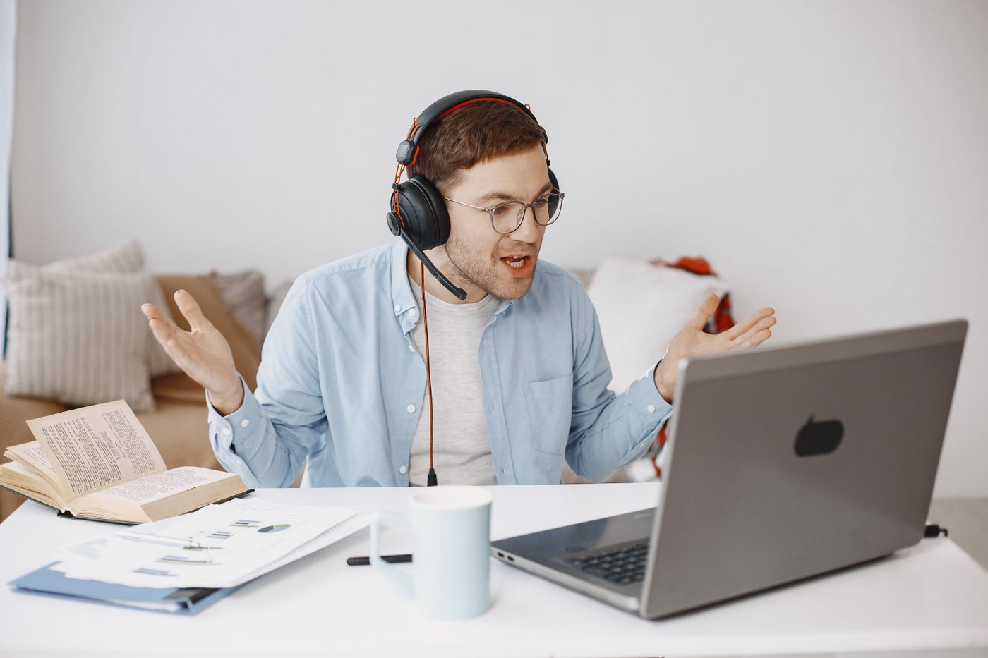 Homeowner checking a phone while experiencing a weak home Wi-Fi connection