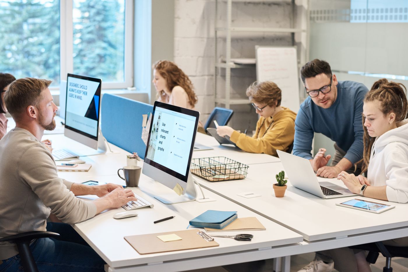Office team using laptops on a professionally planned business Wi-Fi network